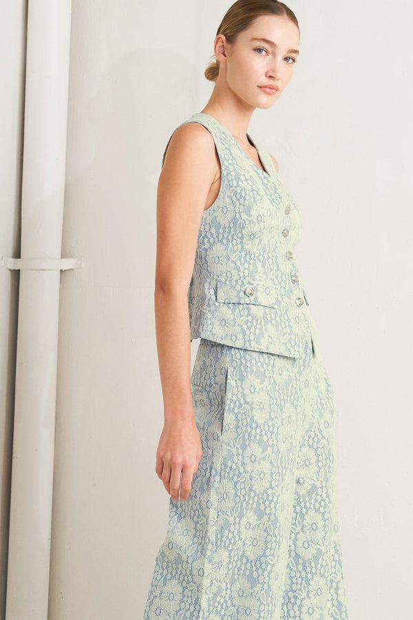 A woven bonded lace vest featuring V neckline, sleeveless and button down

Details:

Self: 50% Rayon 50% Polyester

Size & Fit

-Model is 5`8" And Wearing Size Small
-Measurements Taken From Size Small
-Approx. Length: 22"