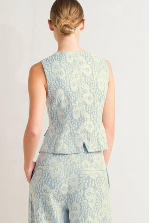 A woven bonded lace vest featuring V neckline, sleeveless and button down

Details:

Self: 50% Rayon 50% Polyester

Size & Fit

-Model is 5`8" And Wearing Size Small
-Measurements Taken From Size Small
-Approx. Length: 22"