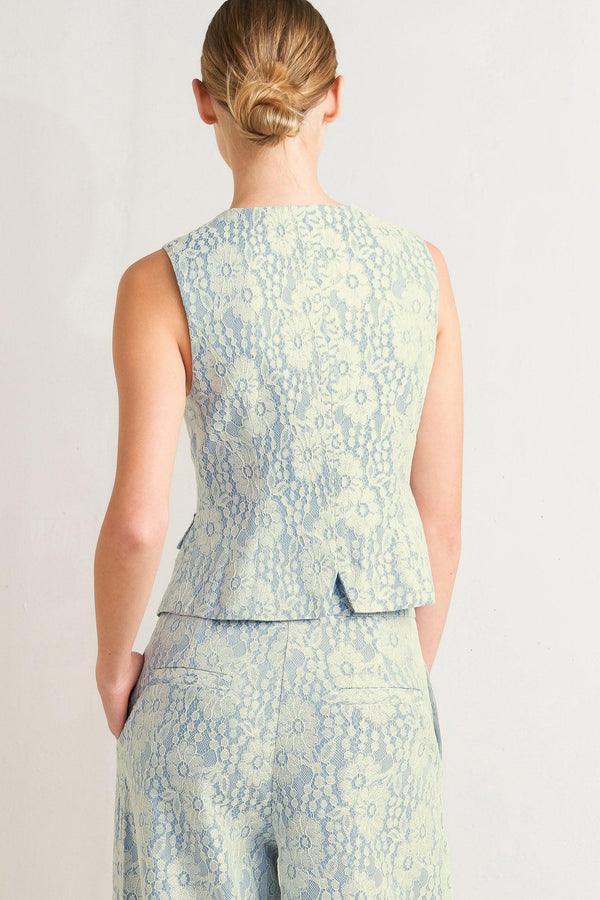 A woven bonded lace vest featuring V neckline, sleeveless and button down

Details:

Self: 50% Rayon 50% Polyester

Size & Fit

-Model is 5`8" And Wearing Size Small
-Measurements Taken From Size Small
-Approx. Length: 22"