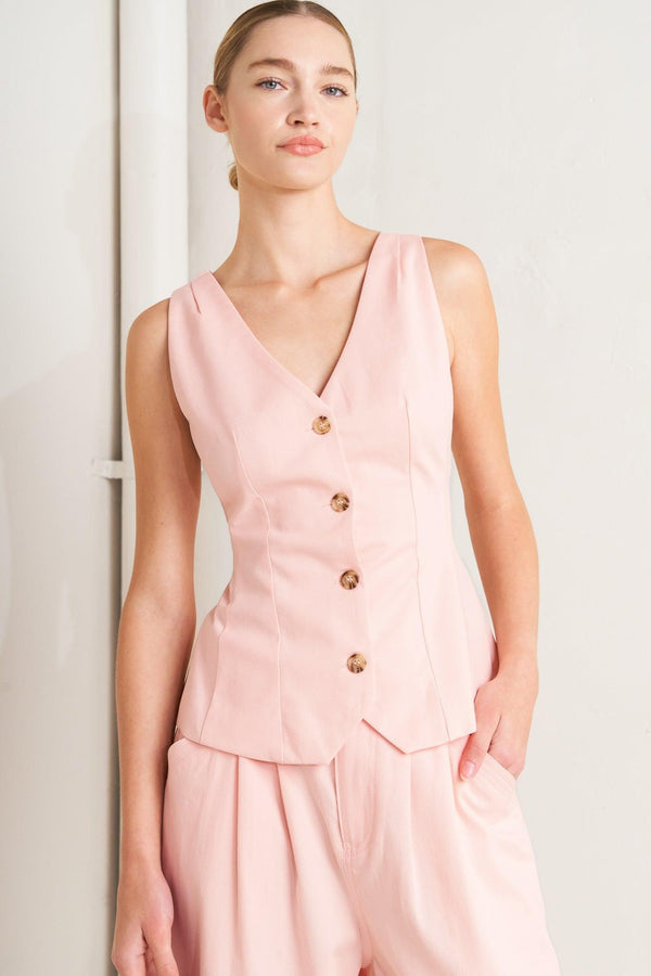 A solid woven vest featuring V neckline, sleeveless, front button down and V back. Matching pant FP1897

Details:

Self : 100% Cotton
Lining : 90% Polyester 10% Cotton

Size &amp; Fit

- Model is 5`8" And Wearing Size Small
- Measurements Taken From Size Small
- Approx. Length: 24"
