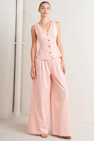 A solid woven vest featuring V neckline, sleeveless, front button down and V back. Matching pant FP1897

Details:

Self : 100% Cotton
Lining : 90% Polyester 10% Cotton

Size &amp; Fit

- Model is 5`8" And Wearing Size Small
- Measurements Taken From Size Small
- Approx. Length: 24"