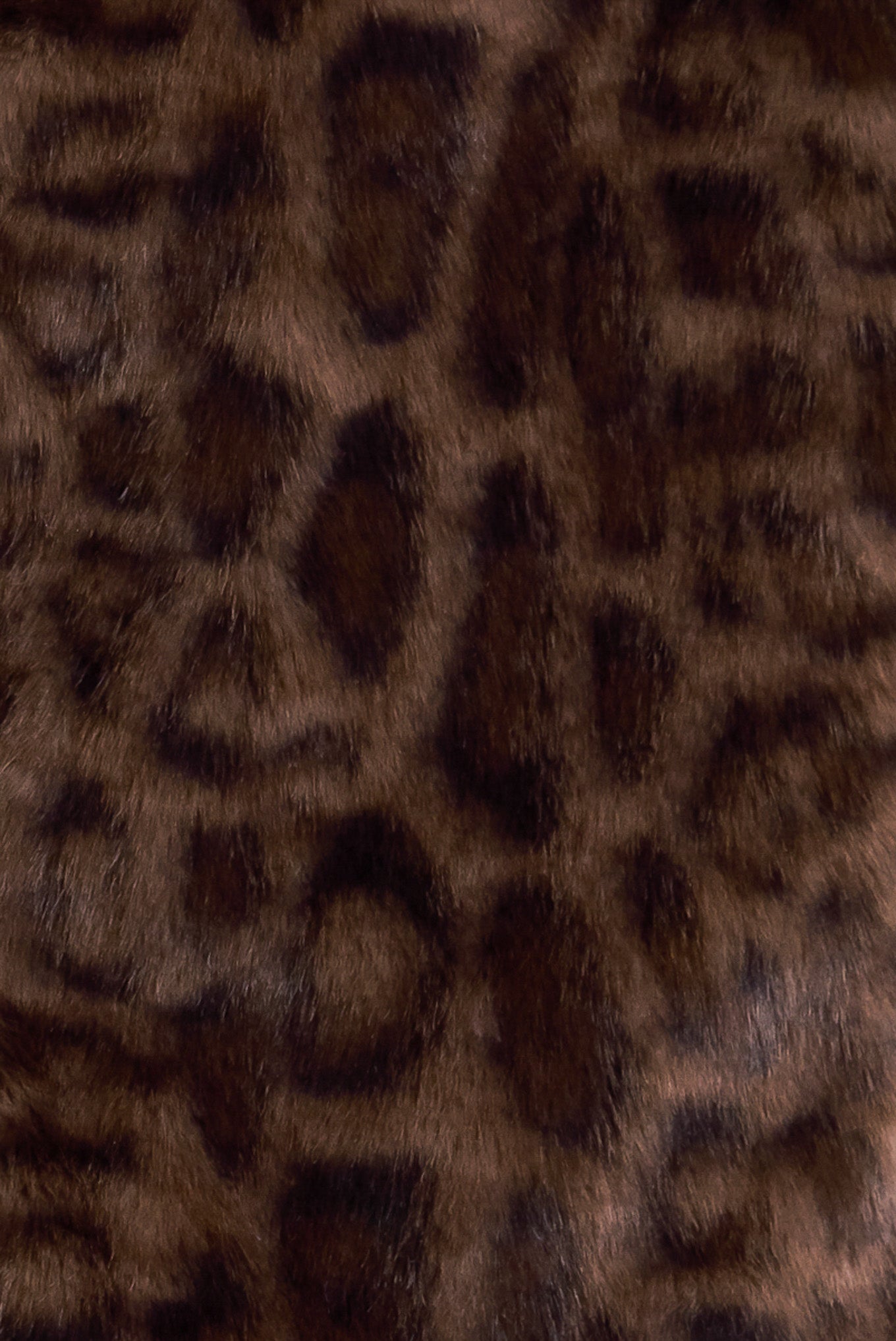 A leopard faux leather jacket with front closure and long sleeve