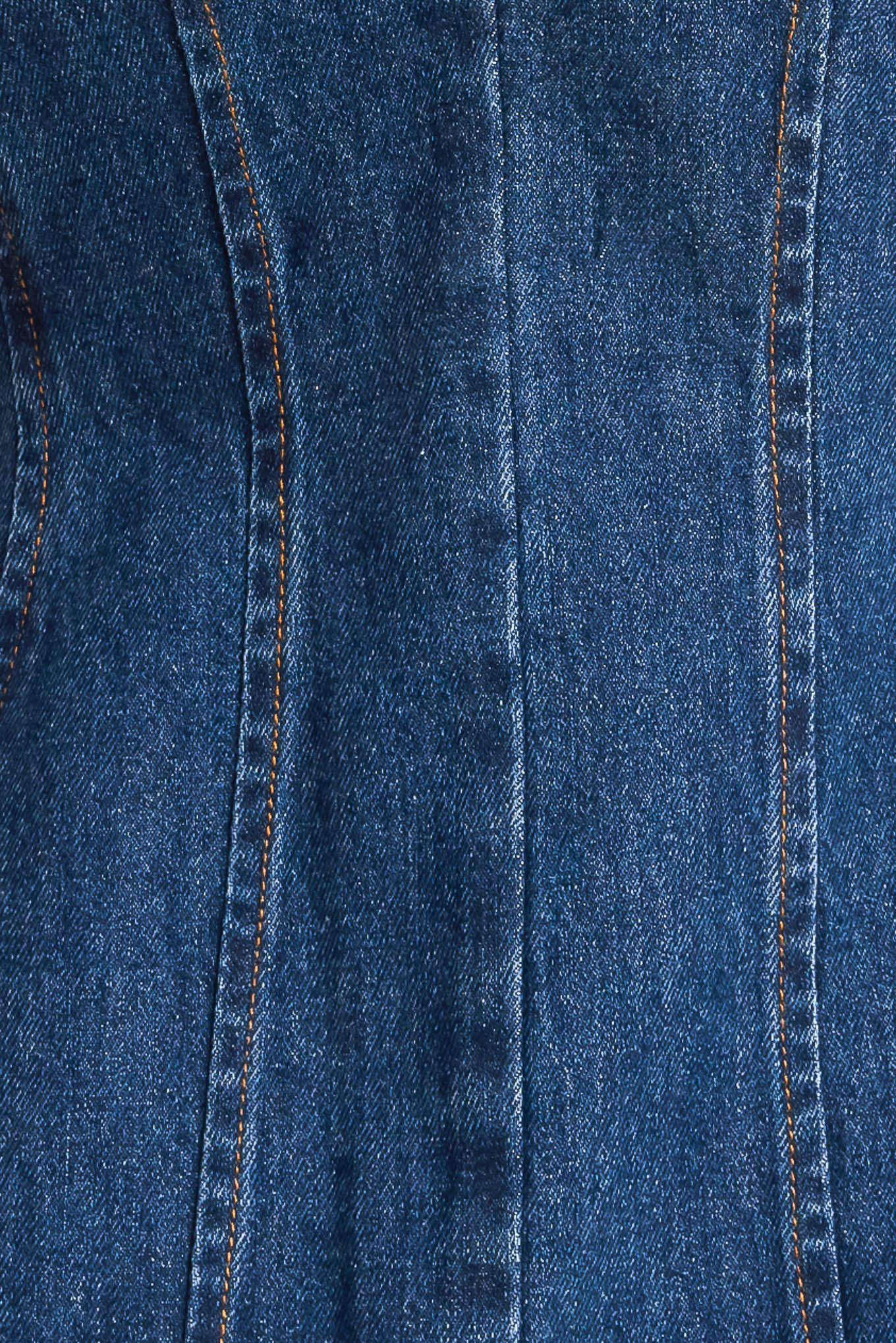 A denim vest featuring front and back V neckline and front button closure.