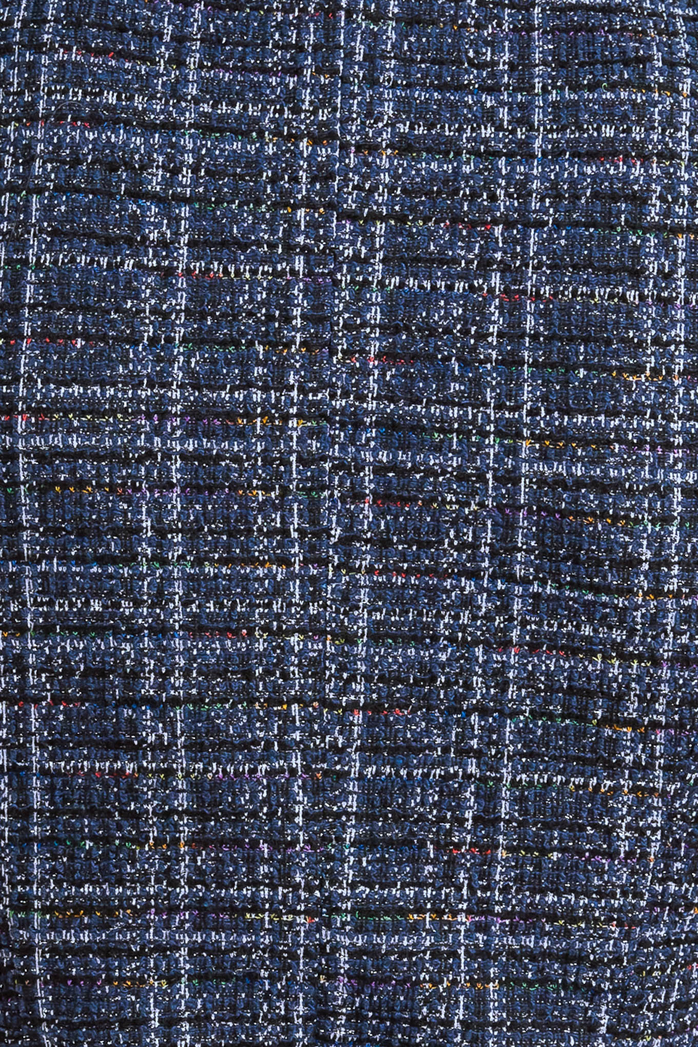 A tweed vest with front button closure