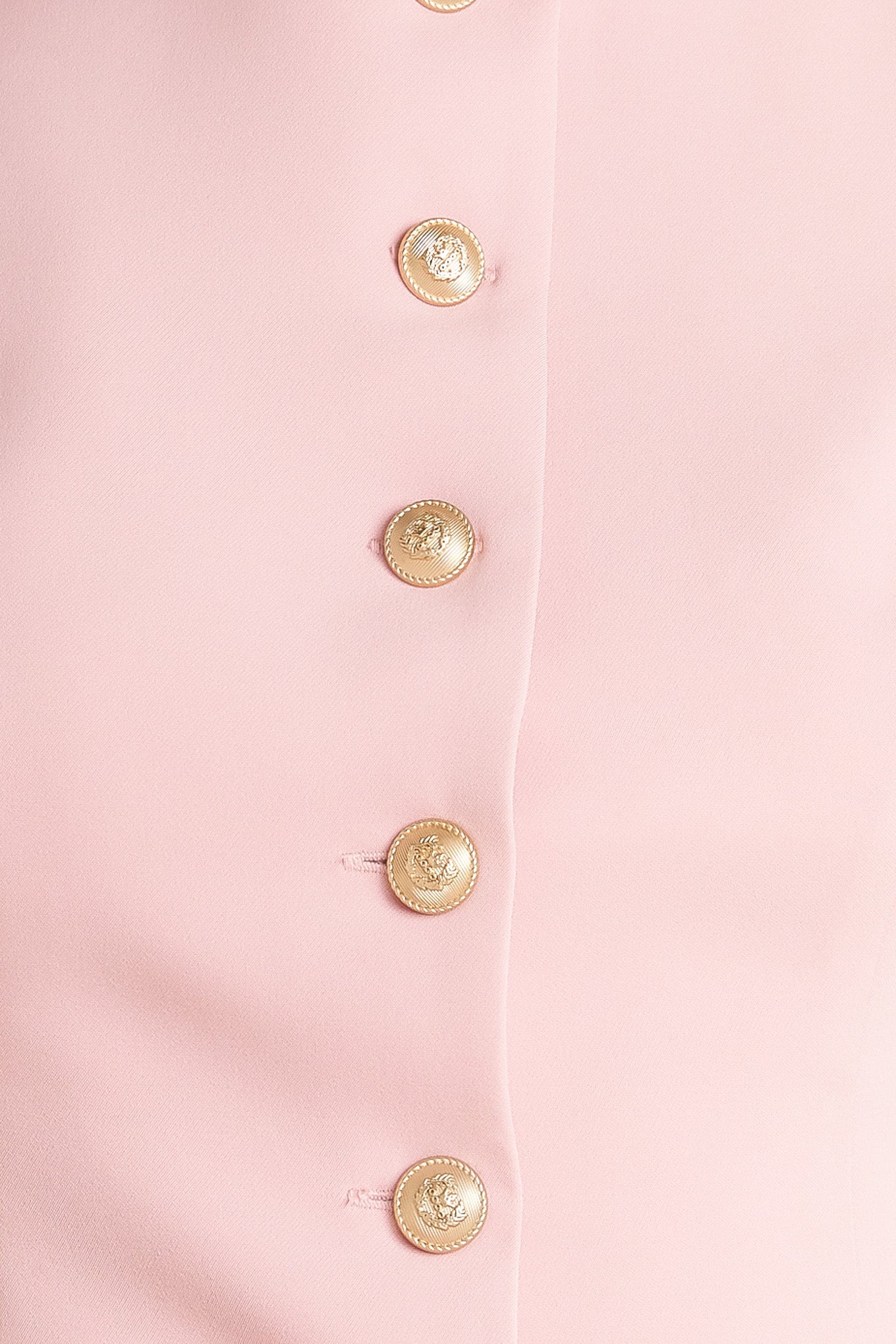 A solid woven vest featuring round neckline, sleeveless and front button down closure.