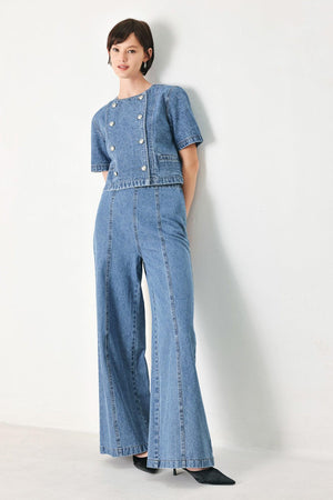A washed denim jacket featuring round neckline, elbow sleeve, double button down and side pocket.