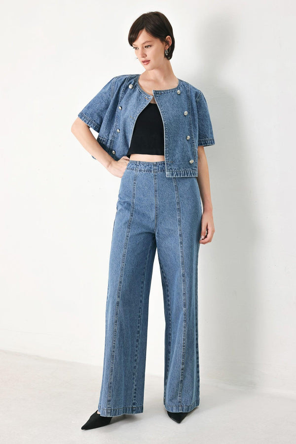 A washed denim jacket featuring round neckline, elbow sleeve, double button down and side pocket.