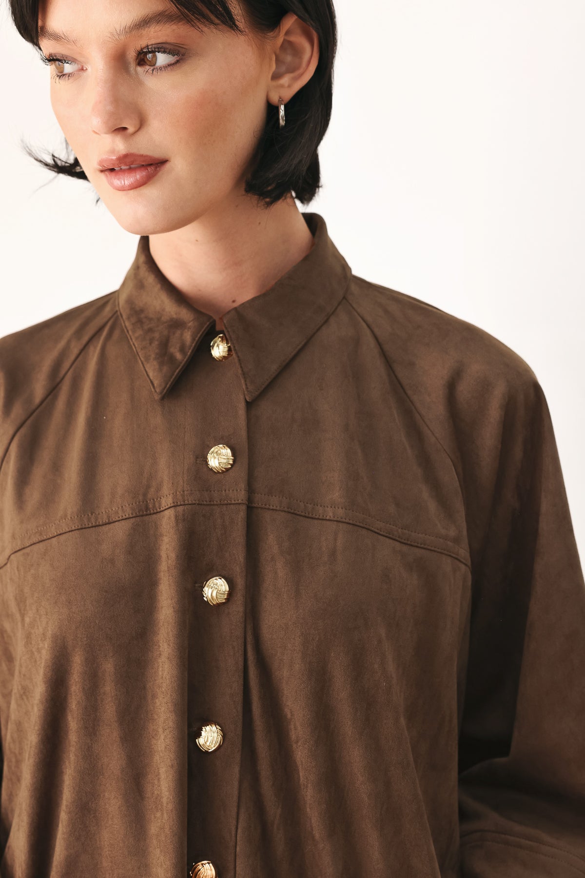 A model wearing a brown corduroy short-sleeve button-up shirt | FREEMARKET