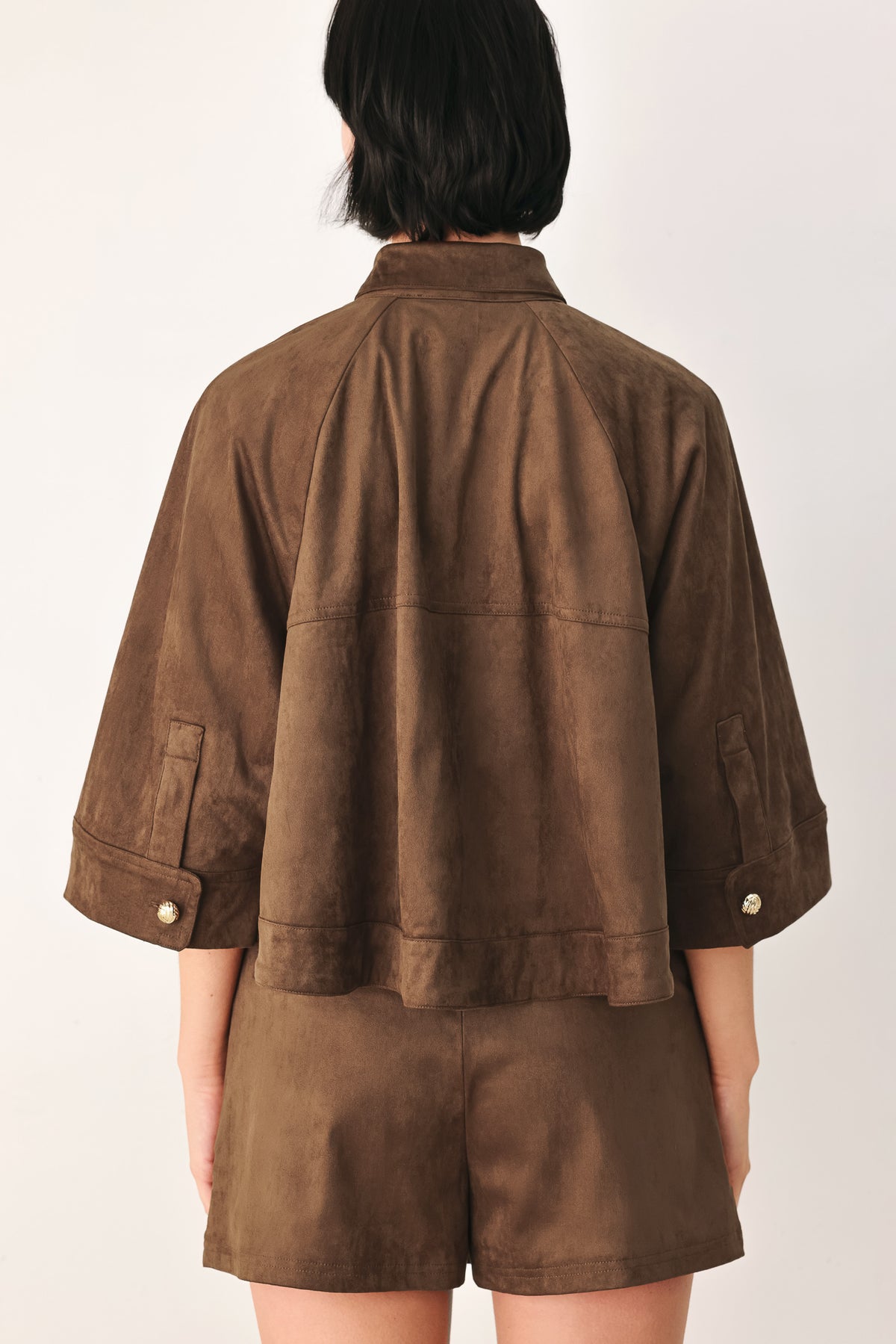 A model wearing a brown corduroy short-sleeve button-up shirt | FREEMARKET