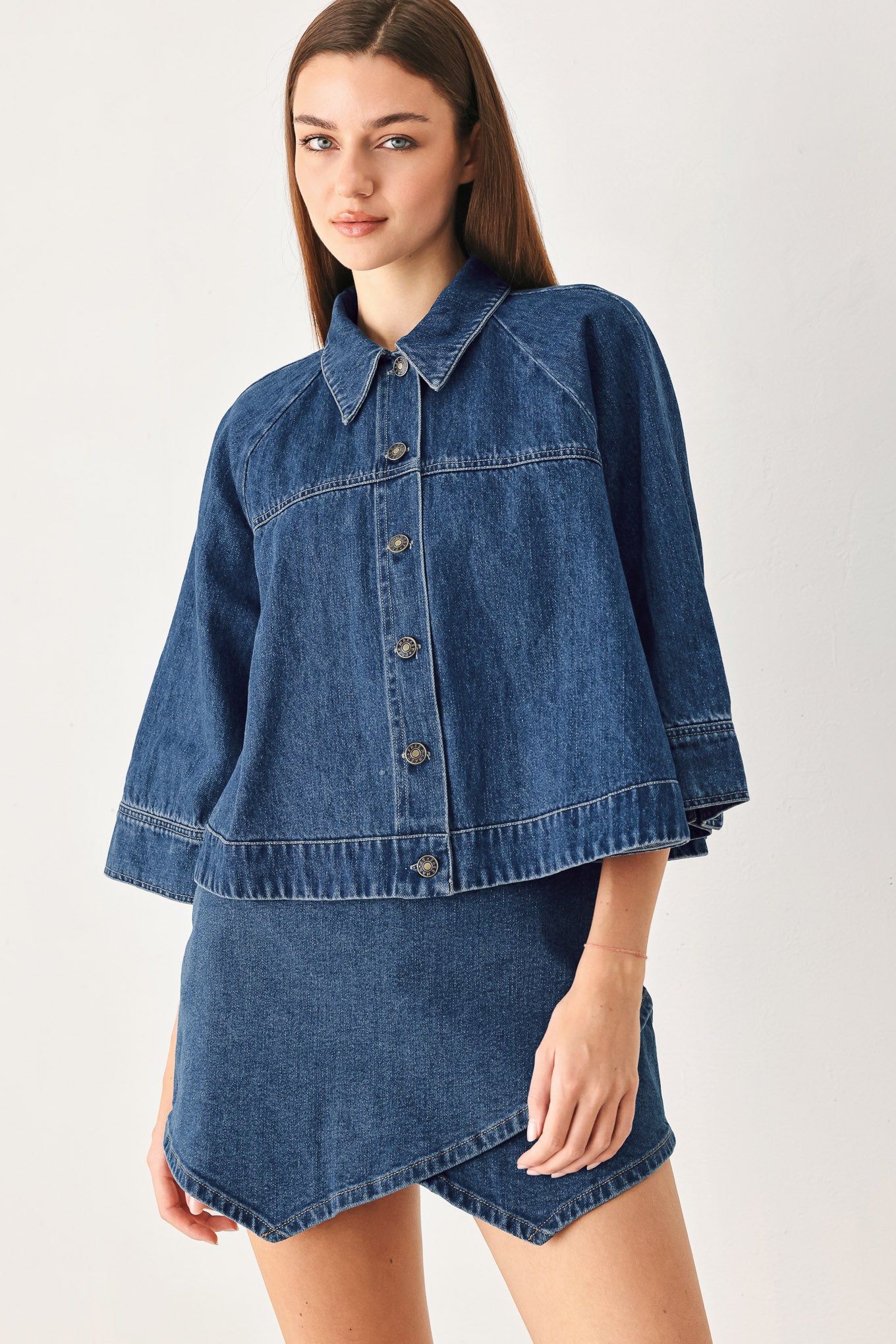 Woman wearing a denim jacket with 3/4 oversized sleeve and button down | FREEMARKET