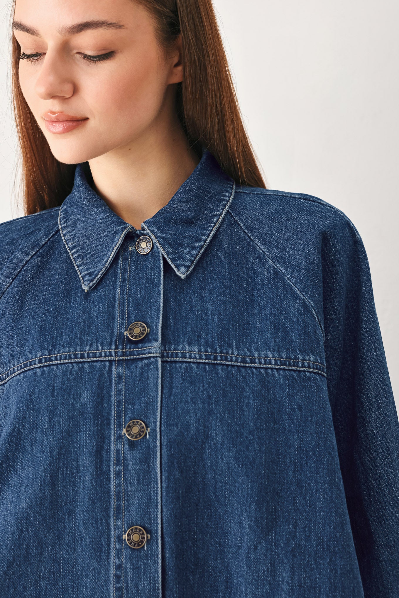Woman wearing a denim jacket with 3/4 oversized sleeve and button down | FREEMARKET