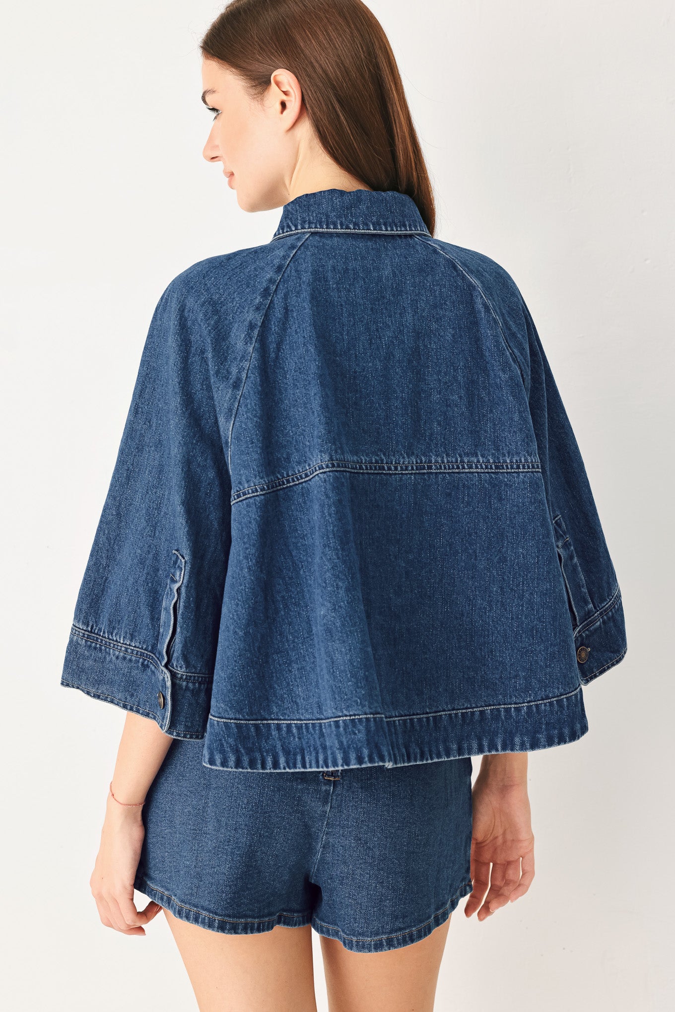 Woman wearing a denim jacket with 3/4 oversized sleeve and button down | FREEMARKET
