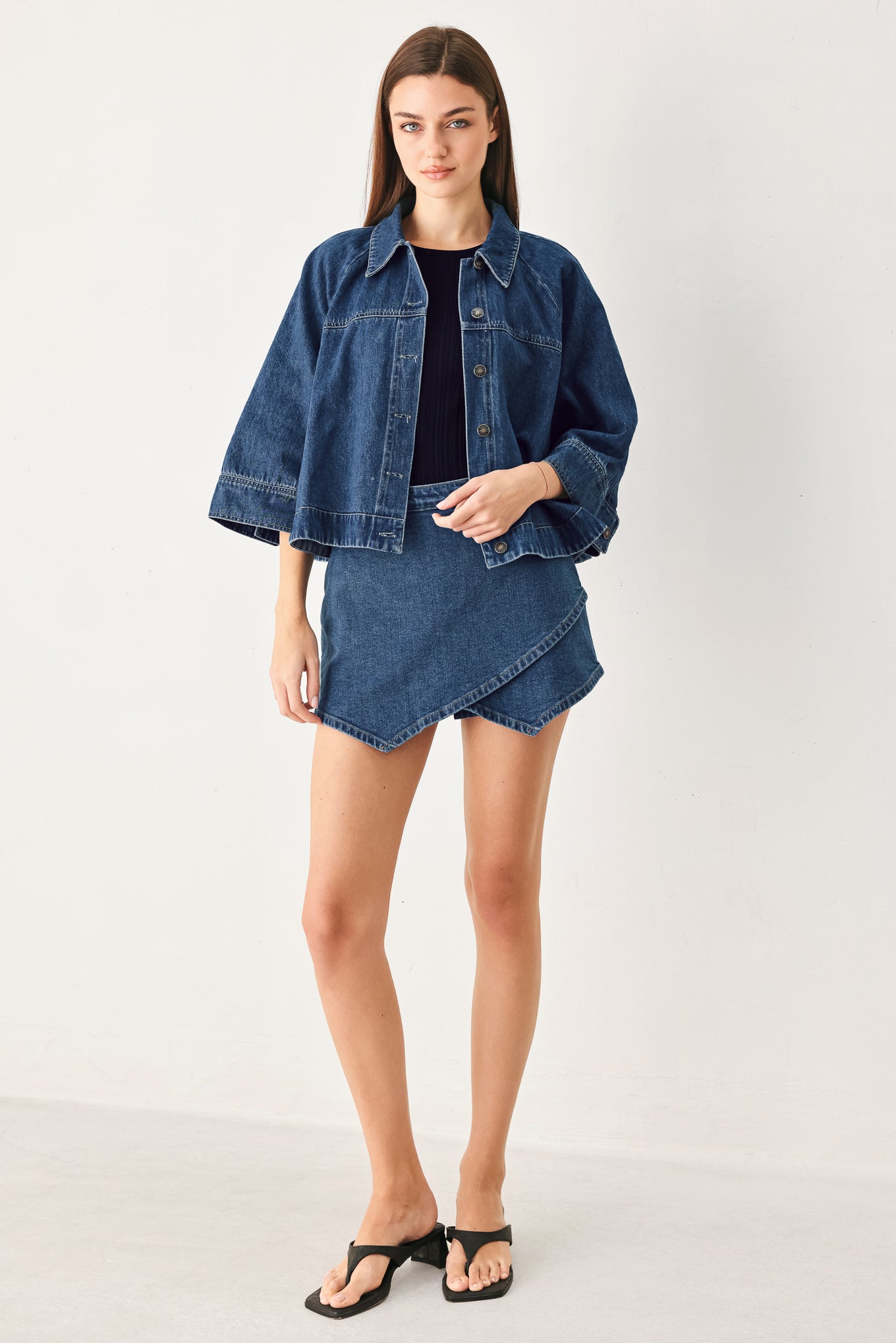 Woman wearing a denim jacket with 3/4 oversized sleeve and button down | FREEMARKET