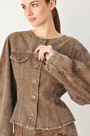 Woman wearing a washed brown denim jacket with round neckline and front button down | FREEMARKET