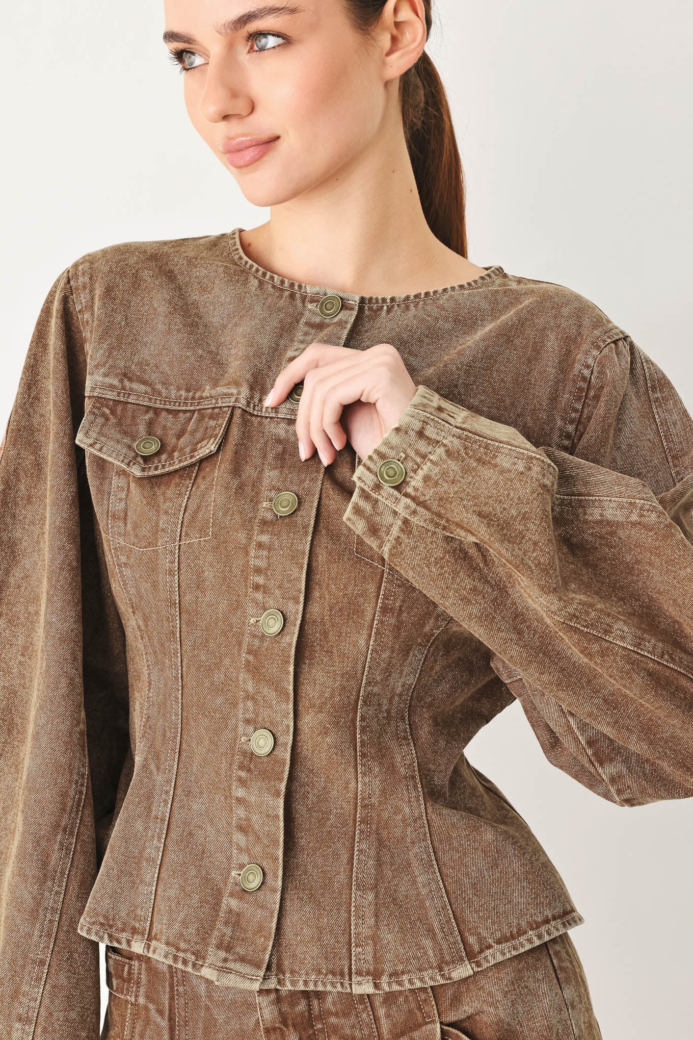 A washed denim jacket with round neckline, long sleeve and front button down. Matching pants FP2132T