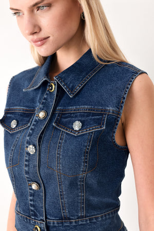 Woman wearing a blue denim cropped vest with front button down and sleeveless | FREEMARKET
