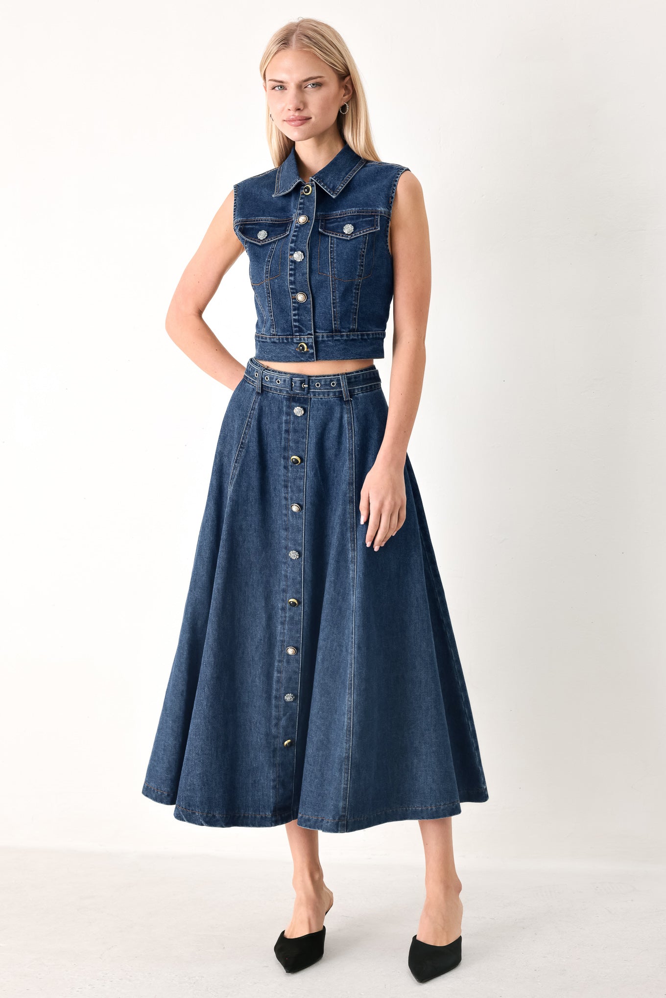 Woman wearing a blue denim cropped vest with front button down and sleeveless | FREEMARKET
