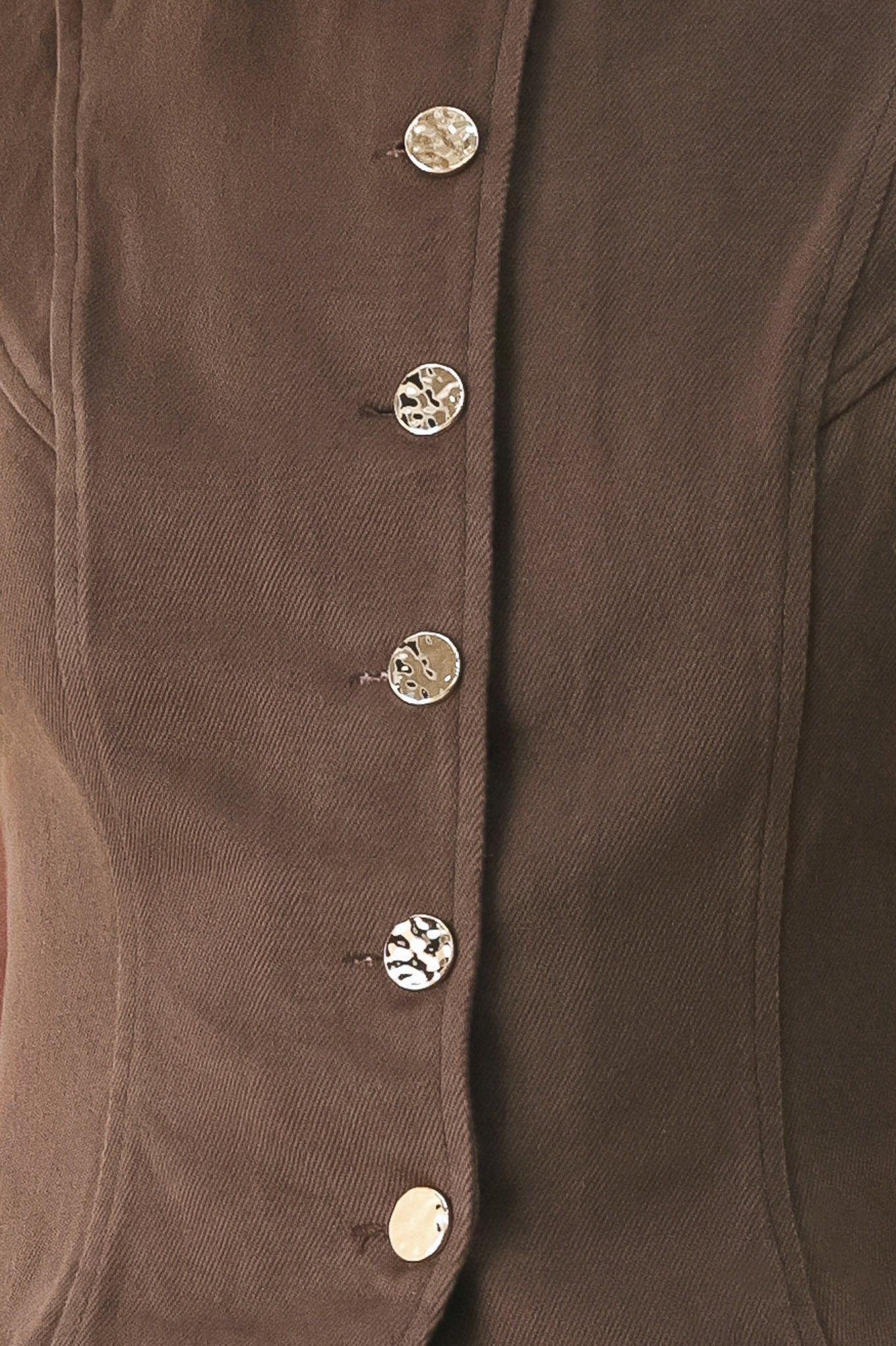 Woman wearing a brown sleeveless vest with round neckline, buttons and matching pants | FREEMARKET 