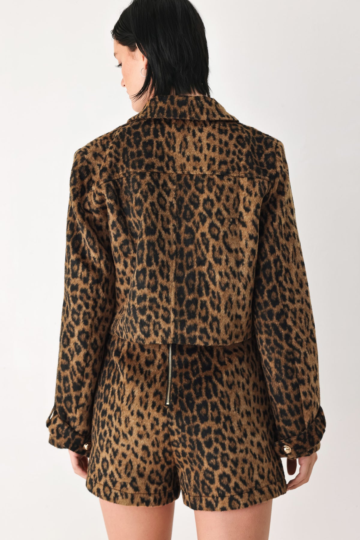 A model wearing a brown and black leopard print jacket with gold-tone buttons | FREEMARKET