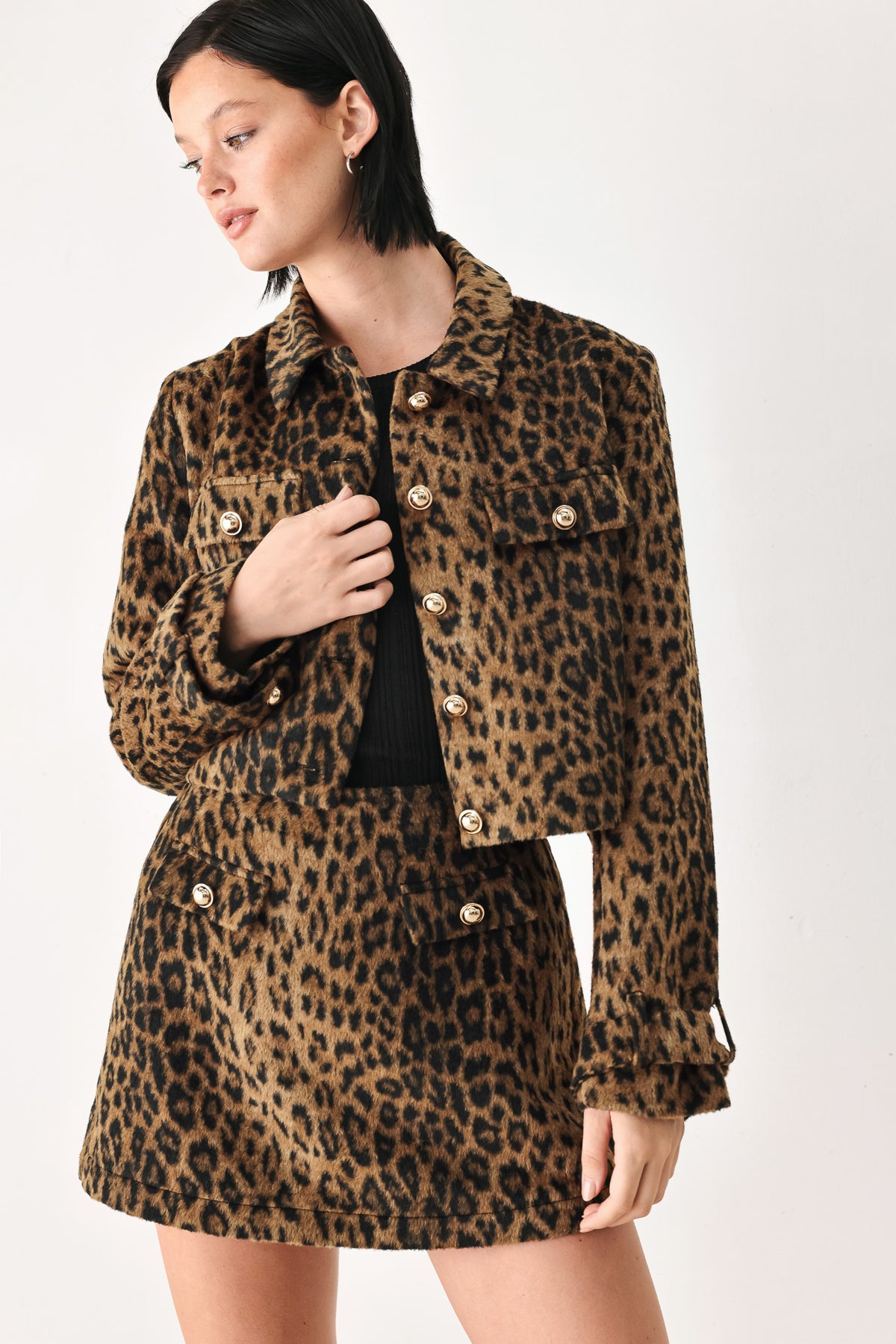 A model wearing a brown and black leopard print jacket with gold-tone buttons | FREEMARKET