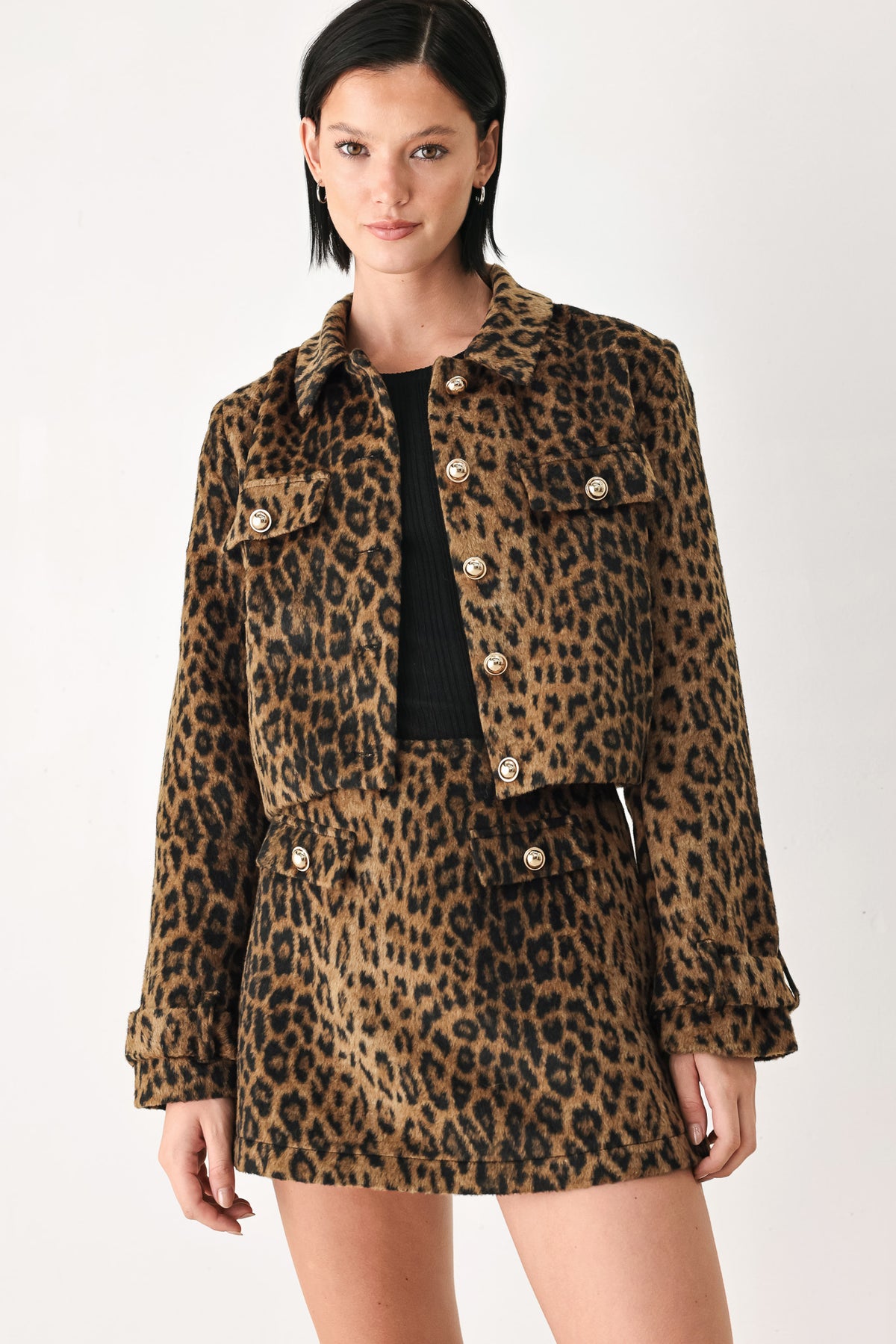 A model wearing a brown and black leopard print jacket with gold-tone buttons | FREEMARKET
