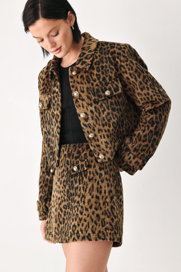 A model wearing a brown and black leopard print jacket with gold-tone buttons | FREEMARKET