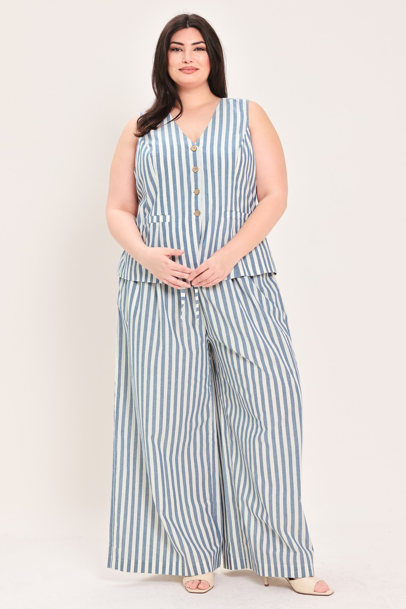 Woman wearing a a striped woven vest with front closure and sleeveless | FREEMARKET