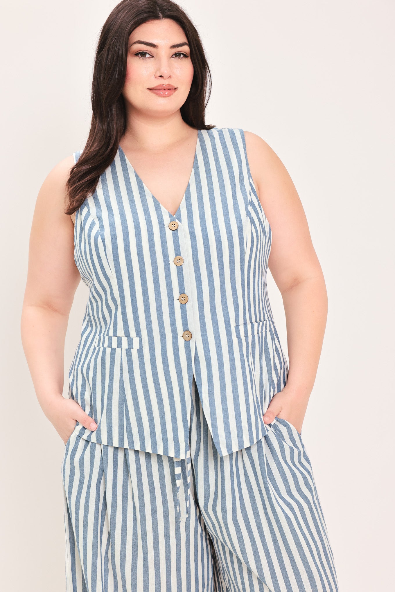 Woman wearing a a striped woven vest with front closure and sleeveless | FREEMARKET