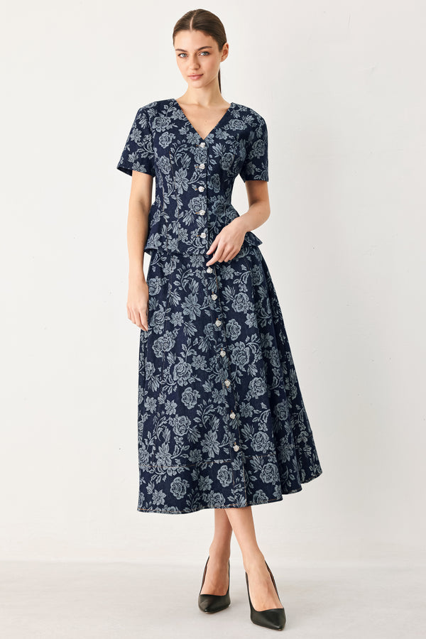 Woman wearing a denim woven jacquard top with V neckline, short sleeve, front button down and peplum | FREEMARKET