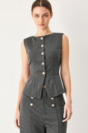 Woman wearing a charcoal and white striped stretch woven vest with wide neckline, sleeveless and front button closure | FREEMARKET