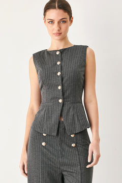 Woman wearing a charcoal and white striped stretch woven vest with wide neckline, sleeveless and front button closure | FREEMARKET