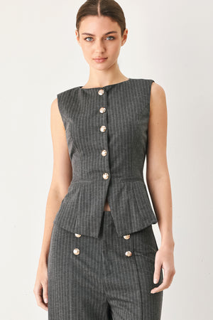 Woman wearing a charcoal and white striped stretch woven vest with wide neckline, sleeveless and front button closure | FREEMARKET