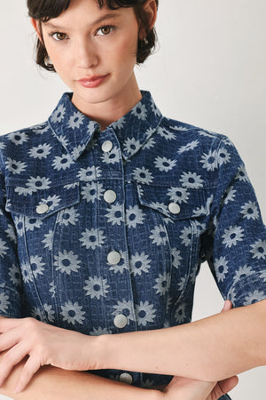 Woman wearing a blue denim floral patterned jacquard crop jacket featuring collar, elbow sleeve and front button closure | FREEMARKET