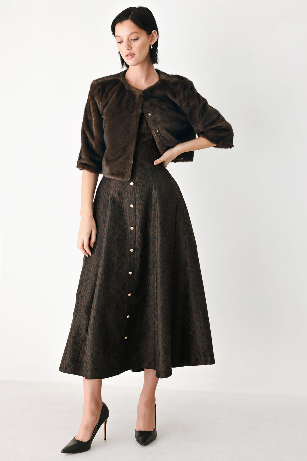 A model wearing a dark brown faux fur cropped jacket | FREEMARKET