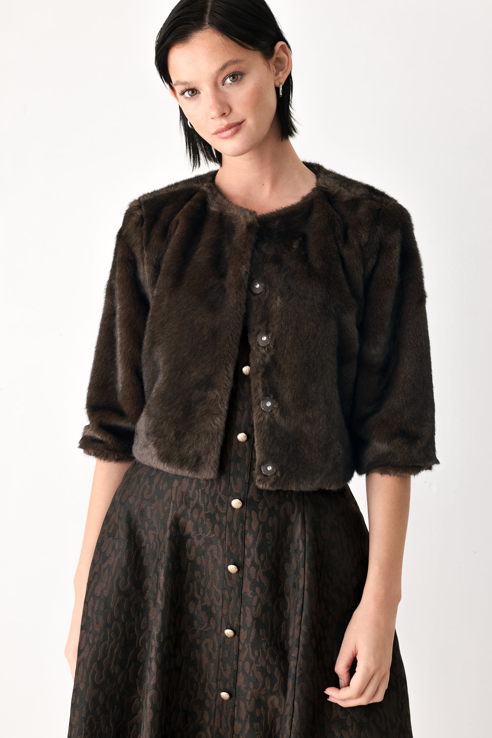 A model wearing a dark brown faux fur cropped jacket | FREEMARKET