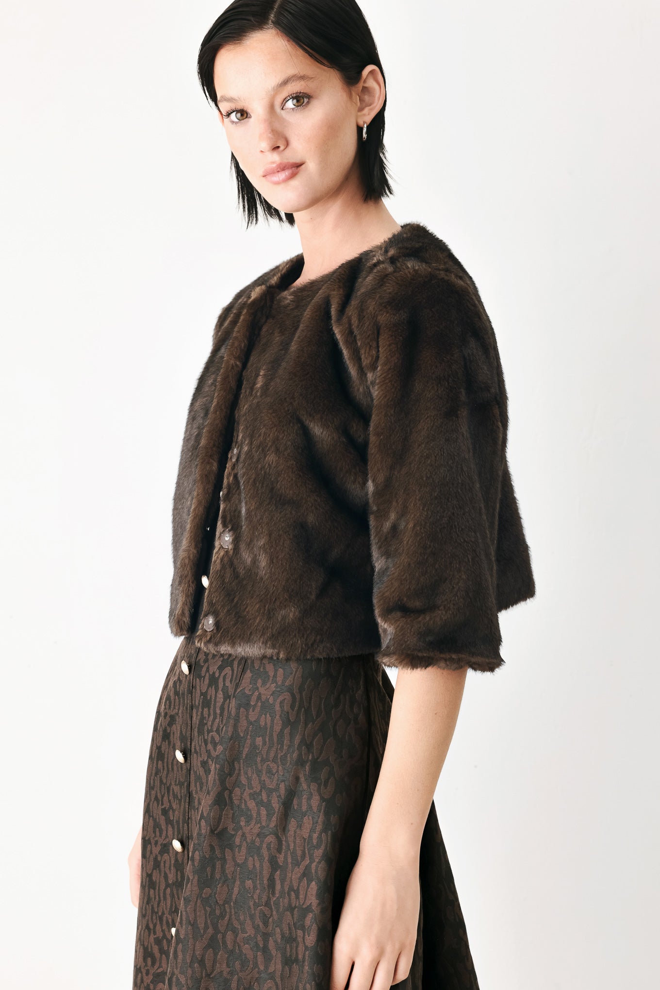 A model wearing a dark brown faux fur cropped jacket | FREEMARKET