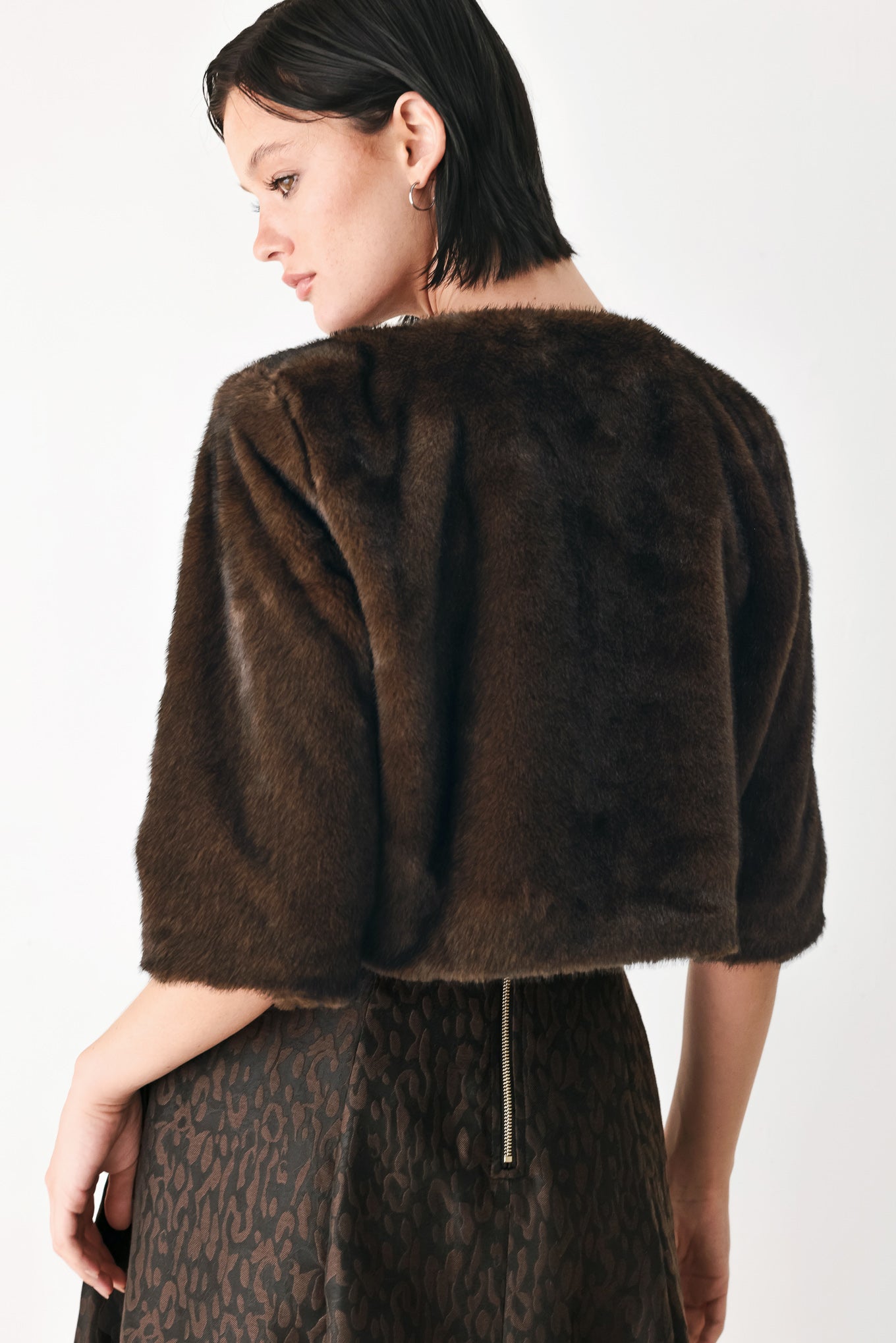 A model wearing a dark brown faux fur cropped jacket | FREEMARKET