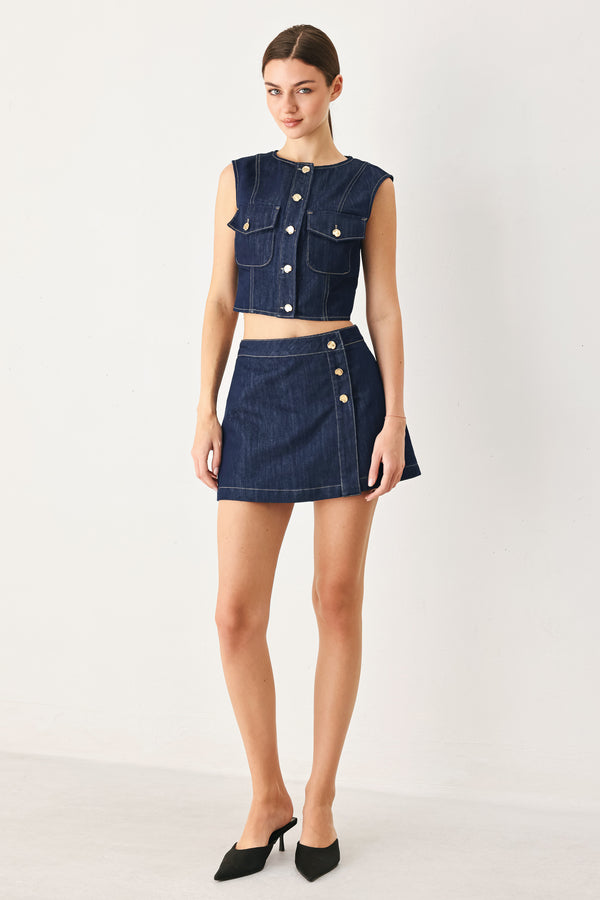 Woman wearing a denim denim crop vest with front button closure | FREEMARKET
