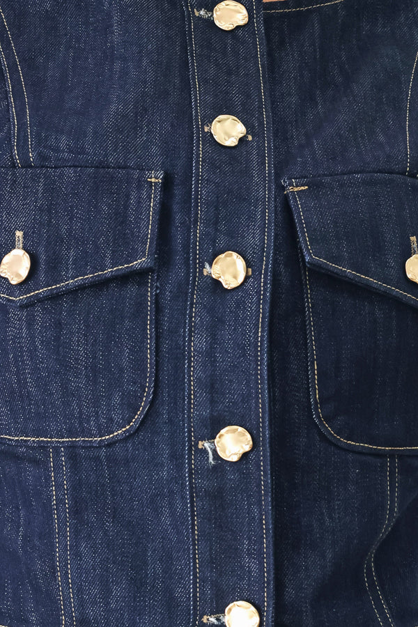 Woman wearing a denim denim crop vest with front button closure | FREEMARKET