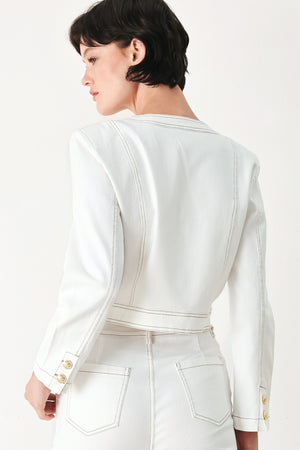 Woman wearing a white denim crop jacket featuring round neckline, long sleeve, pockets and front button down | FREEMARKET