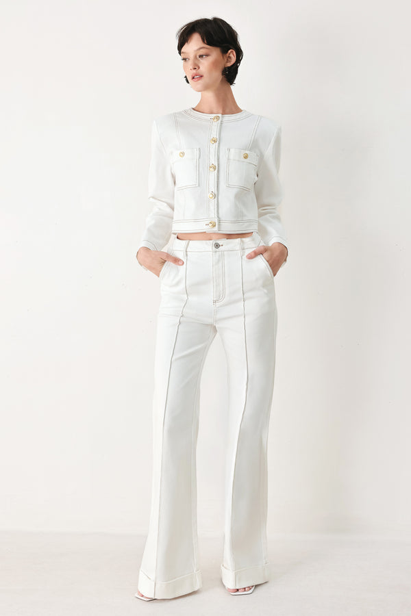Woman wearing a white denim crop jacket featuring round neckline, long sleeve, pockets and front button down | FREEMARKET
