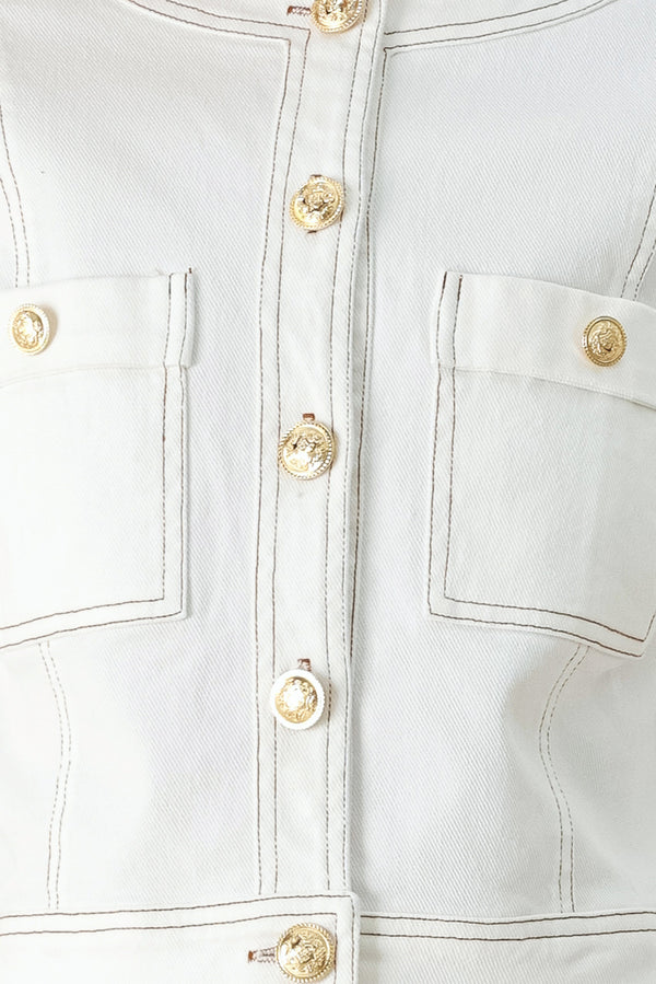 Close-up of a white denim jacket with gold buttons | FREEMARKET
