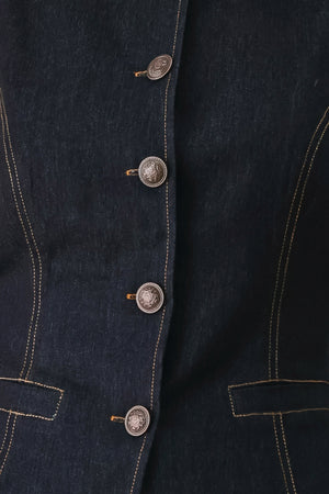 Woman wearing a dark denim vest with wide neckline and front button down | FREEMARKET