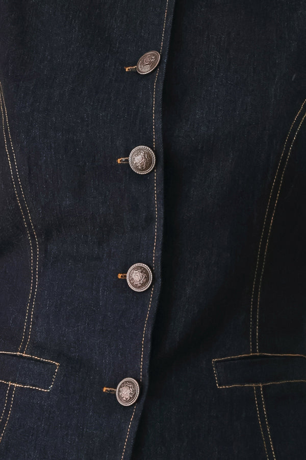 Woman wearing a dark denim vest with wide neckline and front button down | FREEMARKET