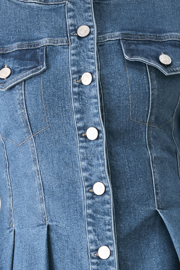 A woman wearing a cropped blue denim jacket with silver buttons and peplum waist | FREEMARKET