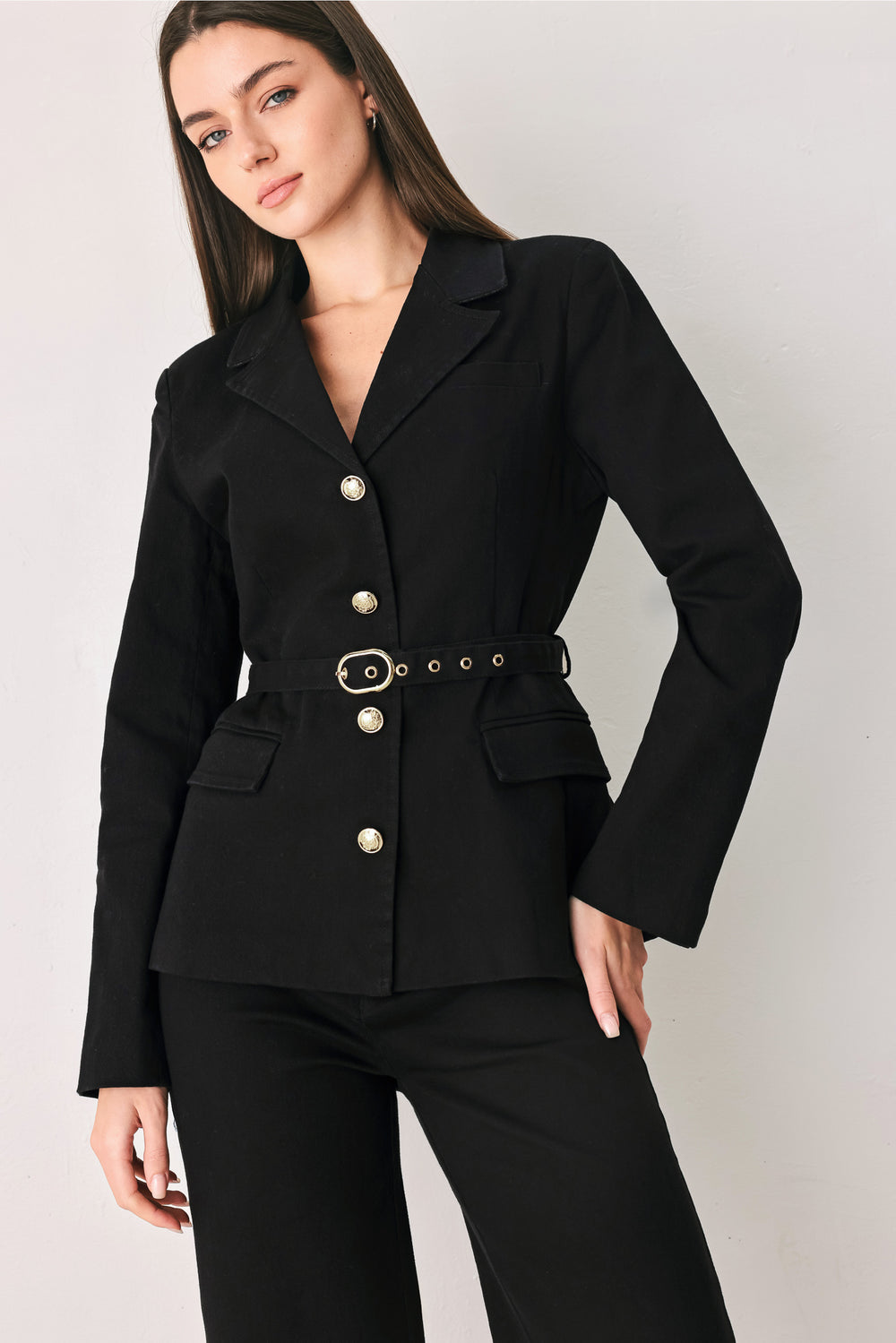 Woman wearing a black denim blazer jacket with gold tone buttons, waist  belt and faux front pockets | FREEMARKET