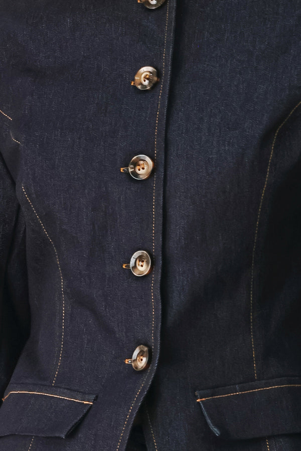 Woman wearing a dark denim jacket with round neckline, long sleeve and front button closure | FREEMARKET