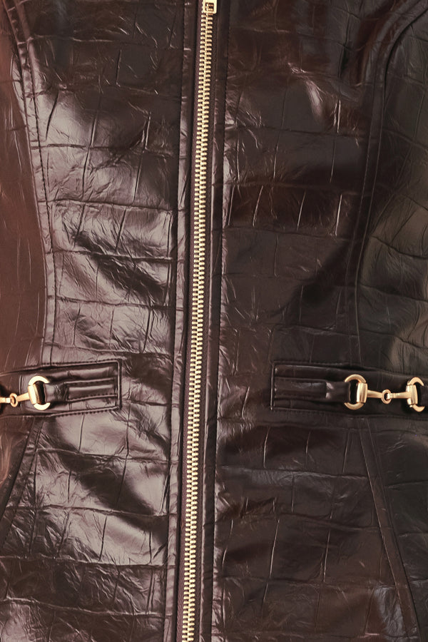 A model wearing a dark brown faux-leather vest with a square neckline, front zipper, and gold-tone hardware details | FREEMARKET