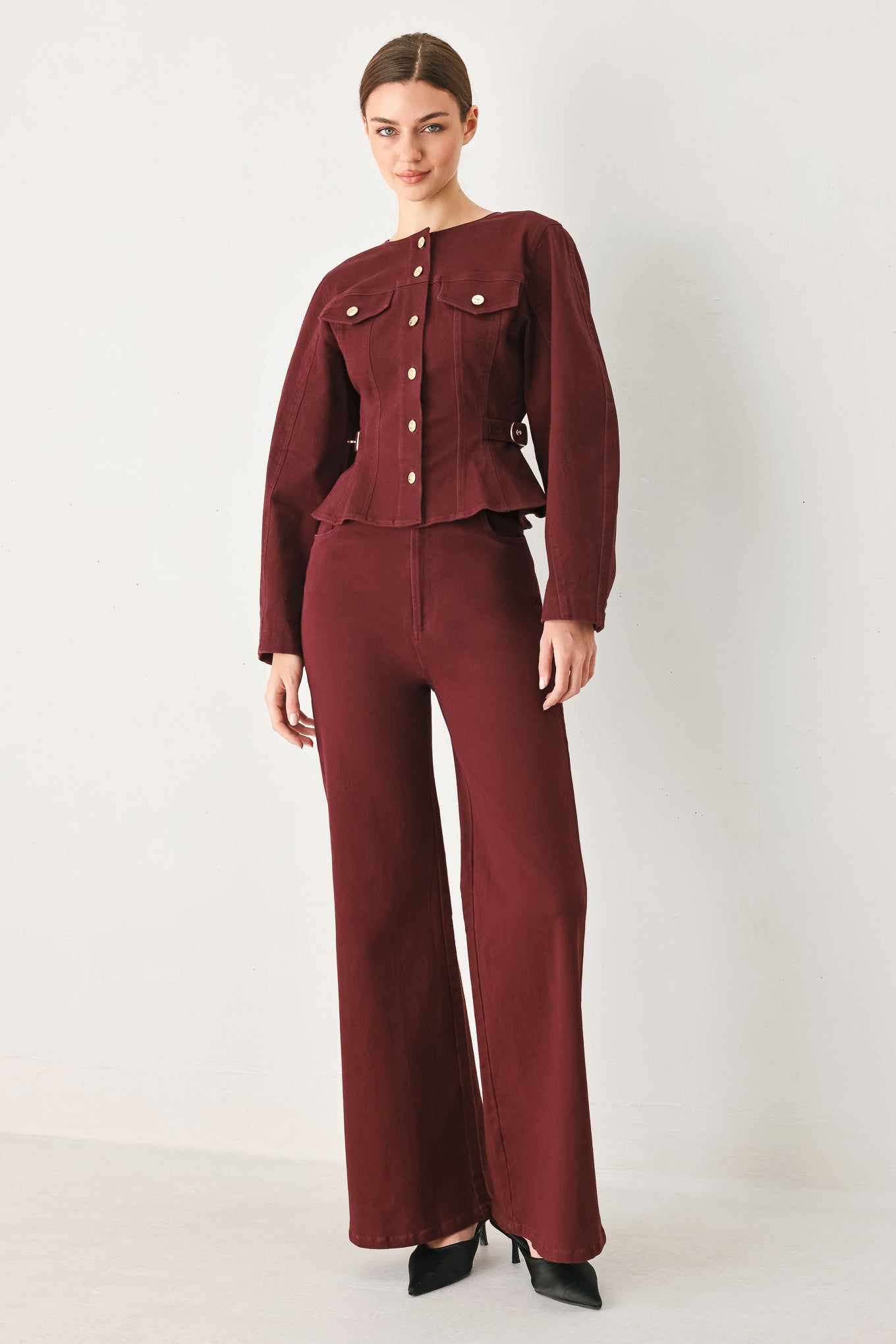 Woman wearing a long-sleeve jacket in deep burgundy with gold-tone buttons | FREEMARKET