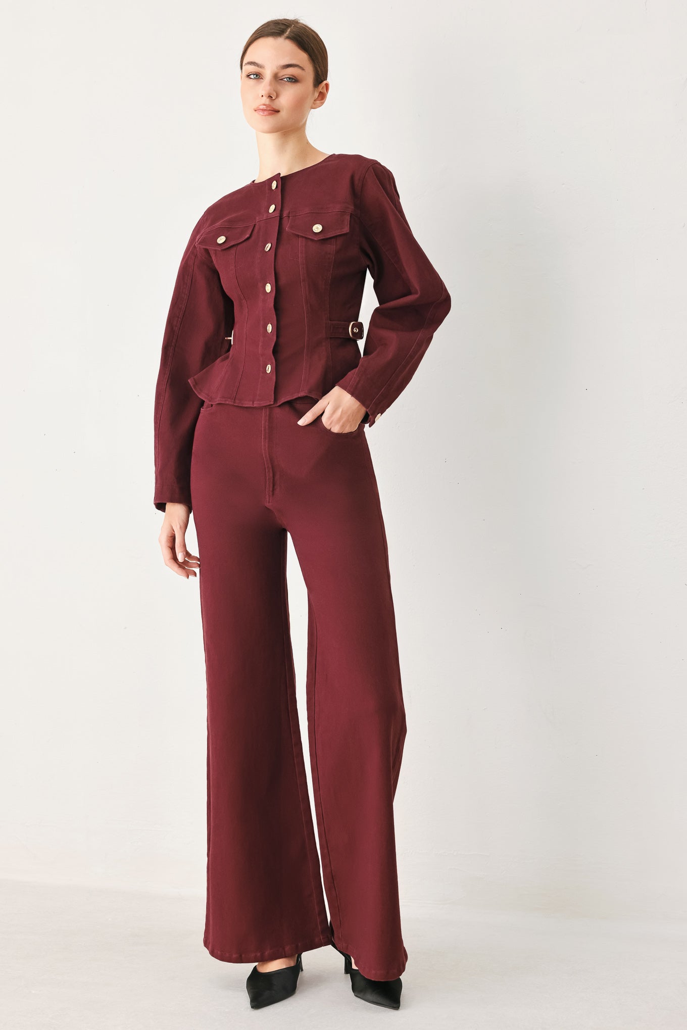 Woman wearing a long-sleeve jacket in deep burgundy with gold-tone buttons | FREEMARKET
